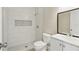Modern bathroom featuring a walk-in shower, stylish tile work, and a vanity with ample storage at 2527 Christine Dr, Kissimmee, FL 34744