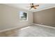 Bedroom showcasing a ceiling fan, tile flooring, and a window view at 2527 Christine Dr, Kissimmee, FL 34744