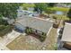Aerial view of the front of a single-story home with a stone facade and well-maintained landscaping at 2527 Christine Dr, Kissimmee, FL 34744