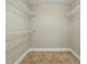 Functional walk-in closet with built-in shelving, providing ample storage space at 2527 Christine Dr, Kissimmee, FL 34744