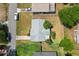 Aerial of a cozy home with a gray roof, green lawn and a driveway with parking space at 1007 3Rd St, Port Orange, FL 32129