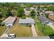 Aerial view of a cozy single-story home with a well-maintained lawn and mature trees at 1007 3Rd St, Port Orange, FL 32129