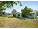 View of the home's fenced-in backyard and back exterior at 1007 3Rd St, Port Orange, FL 32129