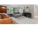 Comfortable living room showcasing a plush sofa, a television, and stylish decor for relaxation and entertainment at 1007 3Rd St, Port Orange, FL 32129