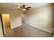Spacious bedroom features carpet, ceiling fan, and entryways to other rooms at 10631 Village Lake Rd, Windermere, FL 34786