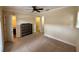 This carpeted bedroom has a fan and access to an ensuite and a closet at 10631 Village Lake Rd, Windermere, FL 34786