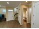 Welcoming entryway features tile flooring, and staircase leading to the upper level of the home at 10631 Village Lake Rd, Windermere, FL 34786