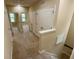 Second floor hallway features neutral paint, carpet, doors to other rooms, and staircase at 10631 Village Lake Rd, Windermere, FL 34786