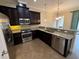 Kitchen featuring stainless appliances and granite counters at 10631 Village Lake Rd, Windermere, FL 34786