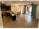 Modern kitchen with stainless steel appliances, granite countertops, and an open layout at 10631 Village Lake Rd, Windermere, FL 34786