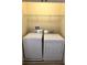 Laundry closet with new washer and dryer at 10631 Village Lake Rd, Windermere, FL 34786