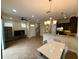 Spacious living area featuring tile flooring, modern lighting and open concept with staircase at 10631 Village Lake Rd, Windermere, FL 34786