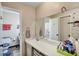 Functional bathroom with a well-lit vanity, ample counter space, and convenient toilet and shower area at 10856 William Tell Dr, Orlando, FL 32821