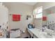 Functional bathroom featuring a toilet, vanity with ample counter space and a shower with a curtain at 10856 William Tell Dr, Orlando, FL 32821