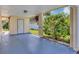 Covered carport area leading to the home's side entrance, offering protection from the elements at 10856 William Tell Dr, Orlando, FL 32821