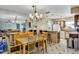 The dining area boasts stylish chandelier lighting, bar seating and plenty of natural light at 10856 William Tell Dr, Orlando, FL 32821