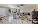 The living room showcases tile floors with a decorative ceiling fan and a window at 10856 William Tell Dr, Orlando, FL 32821