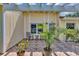 Inviting front patio area with tiled flooring, pergola, and comfortable outdoor seating at 10856 William Tell Dr, Orlando, FL 32821