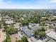 Aerial view of a peaceful residential neighborhood with well-maintained townhomes and lots of trees at 117 E Concord St # 7, Orlando, FL 32801