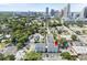 Aerial view of townhomes in a walkable area, with the downtown city skyline in the distance at 117 E Concord St # 7, Orlando, FL 32801