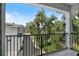 Scenic view from the balcony showcasing nearby houses and tree-lined streets under a clear sky at 117 E Concord St # 7, Orlando, FL 32801