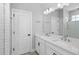 Bright bathroom featuring a double sink vanity with a quartz countertop and tile backsplash at 117 E Concord St # 7, Orlando, FL 32801