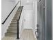 Entryway featuring modern wood-look floors, a coat closet, and stairs to the second floor at 117 E Concord St # 7, Orlando, FL 32801