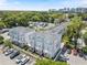 Well-maintained townhomes showcasing modern architecture, private parking, and mature trees at 117 E Concord St # 7, Orlando, FL 32801