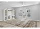 Bright and airy living room with light gray walls, wood floors, a stylish area rug, and a functional built-in entertainment center at 117 E Concord St # 7, Orlando, FL 32801