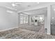 Spacious open-concept living area with wood floors and a modern kitchen featuring abundant natural light from large windows at 117 E Concord St # 7, Orlando, FL 32801