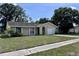 Cozy single-story home with attached one car garage, and driveway at 117 N Alderwood St, Winter Springs, FL 32708