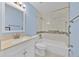 Stylish bathroom with a tub, shower, modern vanity and attractive tiling at 125 Owenshire Cir, Kissimmee, FL 34744