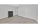 Neutral bedroom with wood-look flooring, closet, and dresser at 125 Owenshire Cir, Kissimmee, FL 34744