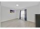 Inviting bedroom with natural light, beach-themed art, and wood-look flooring at 125 Owenshire Cir, Kissimmee, FL 34744