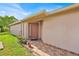 Welcoming front entrance with a brick-paved walkway and charming potted plants at 125 Owenshire Cir, Kissimmee, FL 34744