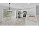 Modern kitchen featuring stainless steel appliances and an adjacent dining area at 125 Owenshire Cir, Kissimmee, FL 34744