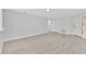 Bright living room featuring neutral paint and modern flooring throughout at 125 Owenshire Cir, Kissimmee, FL 34744