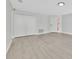 Bright room with wood laminate floors and white closet doors at 125 Owenshire Cir, Kissimmee, FL 34744