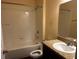 Bathroom featuring granite sink and tub shower combo at 12610 Sawgrass Oak St, Orlando, FL 32824