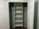 Organized closet with adjustable shelves and ample storage space, ready for your personal touch at 12610 Sawgrass Oak St, Orlando, FL 32824