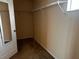 Walk-in closet with neutral walls and shelf at 12610 Sawgrass Oak St, Orlando, FL 32824