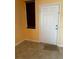 Entryway features neutral walls, tile floor, and a solid door at 12610 Sawgrass Oak St, Orlando, FL 32824