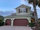 Charming two-story home with a three car garage and well-maintained landscaping at 12610 Sawgrass Oak St, Orlando, FL 32824