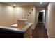 Hallway with soaring ceilings, decorative touches, and pristine hardwood flooring at 12610 Sawgrass Oak St, Orlando, FL 32824
