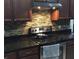 Kitchen featuring granite counters, tile backsplash and stainless steel oven at 12610 Sawgrass Oak St, Orlando, FL 32824