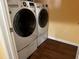Laundry room featuring a modern, front-loading washer and dryer at 12610 Sawgrass Oak St, Orlando, FL 32824
