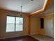 Living room featuring hardwood floors, neutral walls, and abundant natural light at 12610 Sawgrass Oak St, Orlando, FL 32824