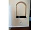 Arched niche with black granite display shelf and neutral walls at 12610 Sawgrass Oak St, Orlando, FL 32824