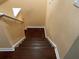 Hardwood staircase featuring well maintained paint and wood flooring at 12610 Sawgrass Oak St, Orlando, FL 32824