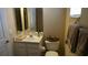 Bathroom featuring a single vanity and a toilet with a window view at 13016 Islamorada Dr, Orlando, FL 32837
